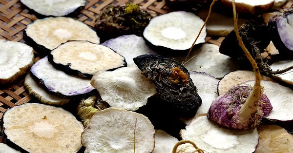 Dried slices of Black Maca root on a woven mat